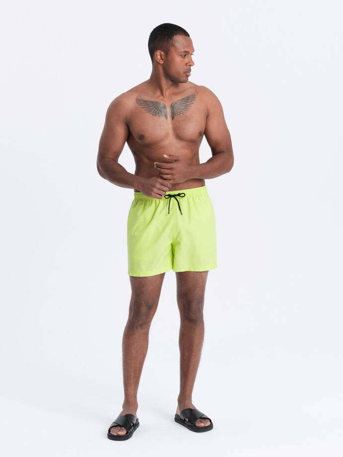 Neonové pánské plavecké šortky s magickým potiskem - limetkově zelené V1 OM-SRBS-0147